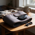 Lumiville WarmWrap cordless heated belt in grey, with its controller and USB cable